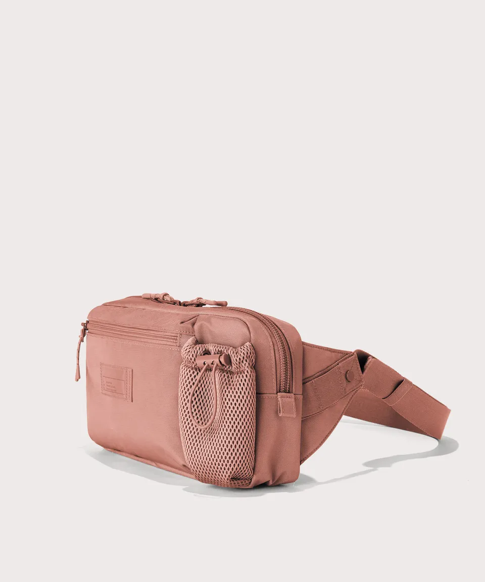 dagne-dover-cairo-sling-bag-in-warm-dust-sustainable-travel-sling-with-water-bot image 1