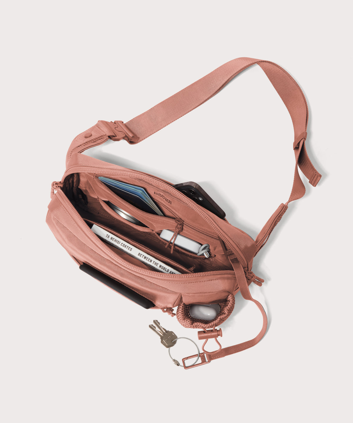 dagne-dover-cairo-sling-bag-in-warm-dust-sustainable-travel-sling-with-water-bot image 2