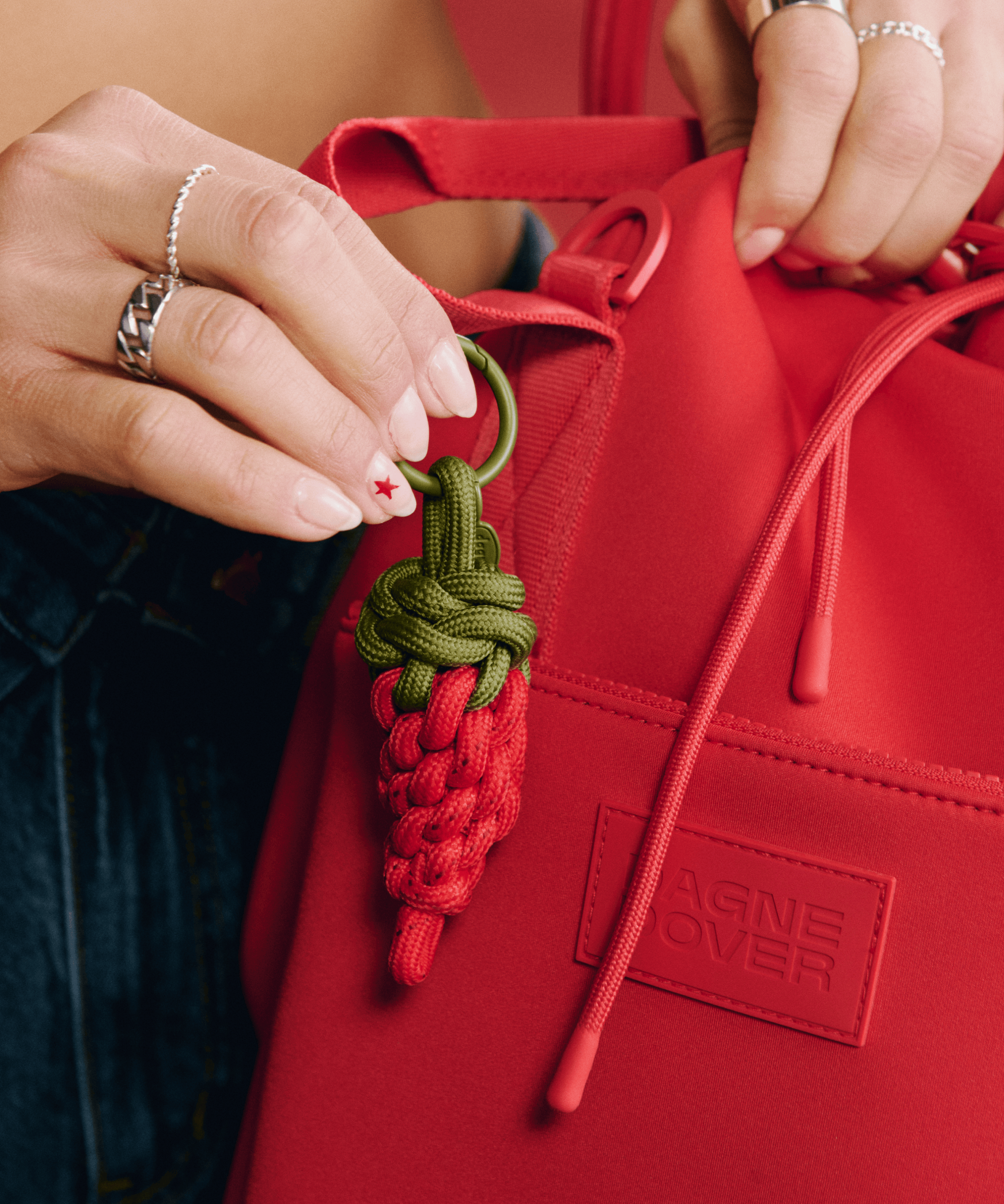 dagne-dover-picante-keychain-in-cherry-neoprene-keychain-with-zippered-pocket-an image 3